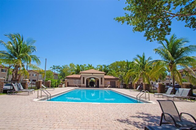 22569 SW 89th Pl, Cutler Bay, FL 33190 - community pool featuring a patio