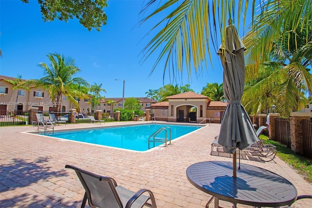 22569 SW 89th Pl, Cutler Bay, FL 33190 - community pool with a patio area