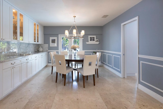 11900 SW 72nd Pl, Pinecrest, FL 33156 - dining area with a chandelier
