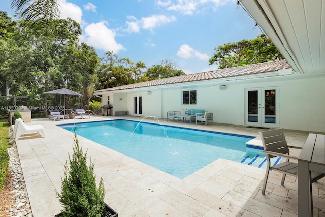11900 SW 72nd Pl, Pinecrest, FL 33156 - outdoor pool featuring french doors and a patio