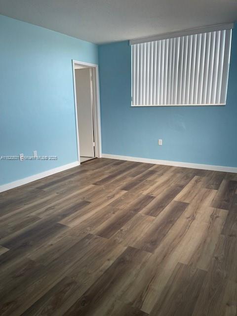 1475 NE 125th Ter Unit 614K, North Miami, FL 33161 - spare room featuring wood finished floors