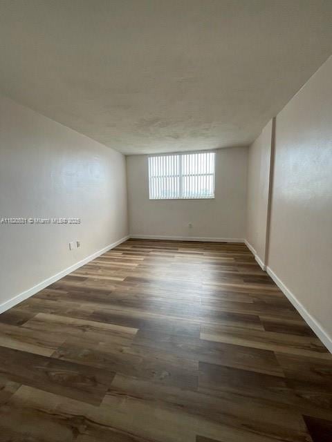 1475 NE 125th Ter Unit 614K, North Miami, FL 33161 - unfurnished room featuring wood finished floors