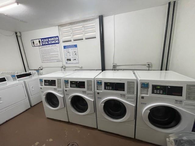 1475 NE 125th Ter Unit 614K, North Miami, FL 33161 - community laundry room featuring washer and clothes dryer
