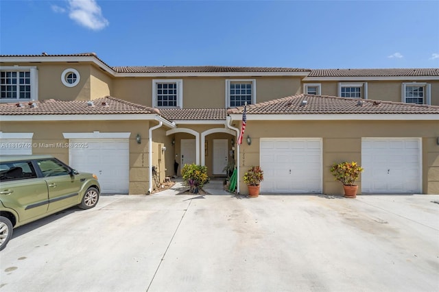 12006 SW 2nd St, Pembroke Pines, FL 33025 - multi unit property featuring stucco siding, driveway, a garage, and a tiled roof