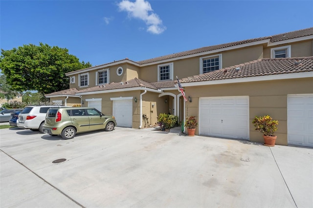 12006 SW 2nd St, Pembroke Pines, FL 33025 - view of property featuring stucco siding, concrete driveway, a garage, and a tile roof