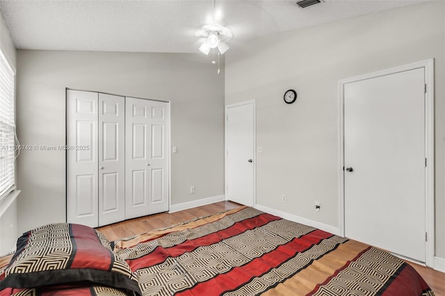 12006 SW 2nd St, Pembroke Pines, FL 33025 - bedroom with wood finished floors, lofted ceiling, a closet, a ceiling fan, and a textured ceiling