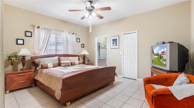 19730 NW 78th Path, Hialeah, FL 33015 - bedroom featuring light tile patterned floors, a closet, ensuite bath, and a ceiling fan
