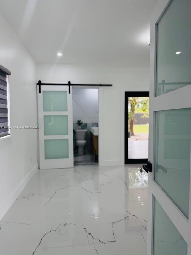 543 E 61st St, Hialeah, FL 33013 - corridor featuring a barn door, marble tiled floors, and recessed lighting