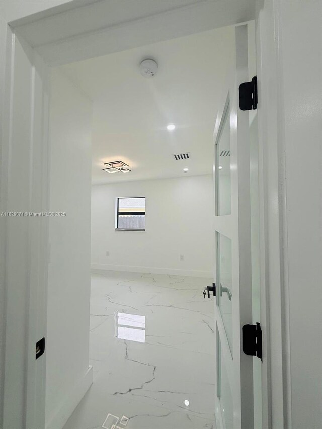543 E 61st St, Hialeah, FL 33013 - bathroom featuring marble finish flooring and baseboards