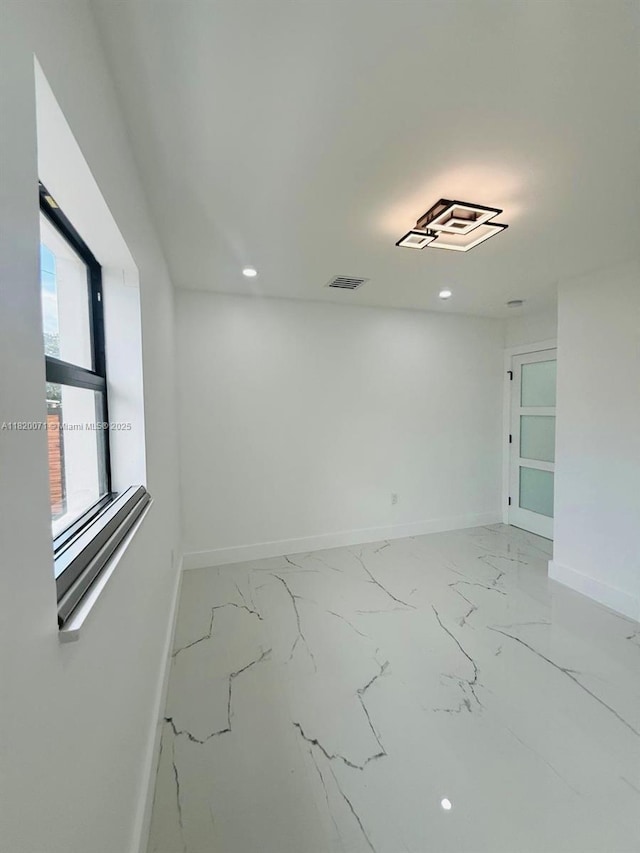 543 E 61st St, Hialeah, FL 33013 - unfurnished room featuring recessed lighting and light marble finish floors