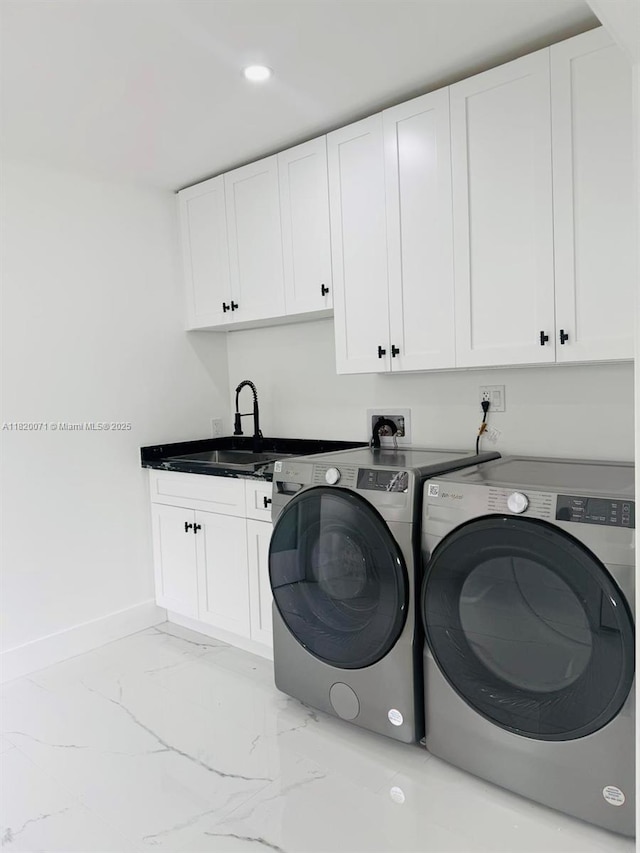 543 E 61st St, Hialeah, FL 33013 - laundry room with washing machine and clothes dryer, light marble finish flooring, cabinet space, and recessed lighting