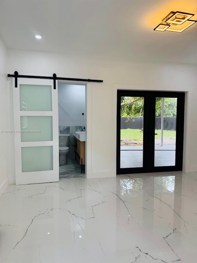 543 E 61st St, Hialeah, FL 33013 - unfurnished room with light marble finish floors, a barn door, and recessed lighting