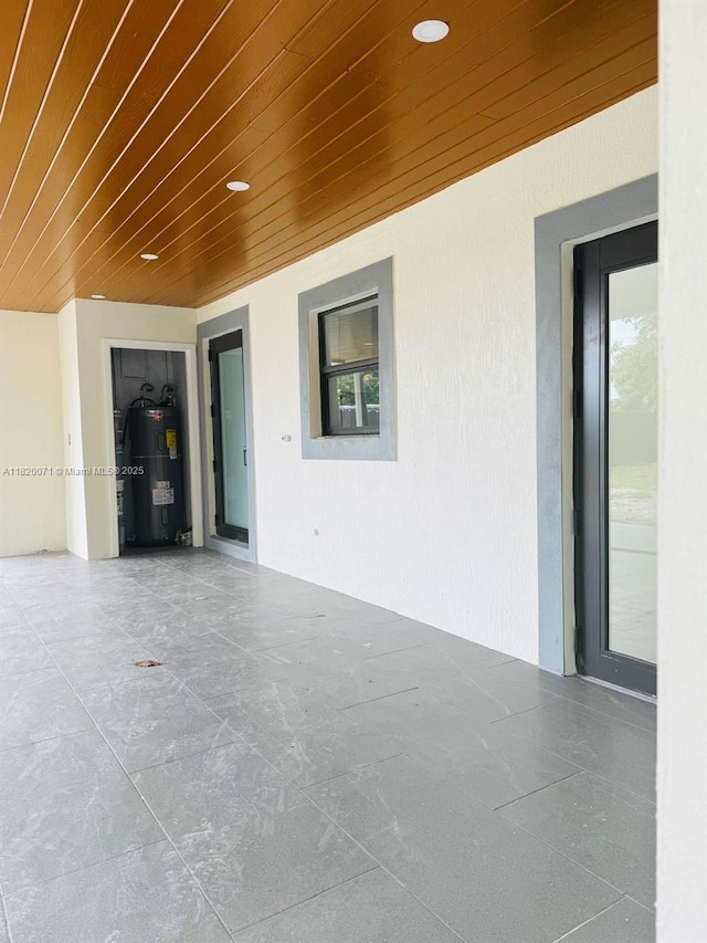 543 E 61st St, Hialeah, FL 33013 - view of patio / terrace with water heater