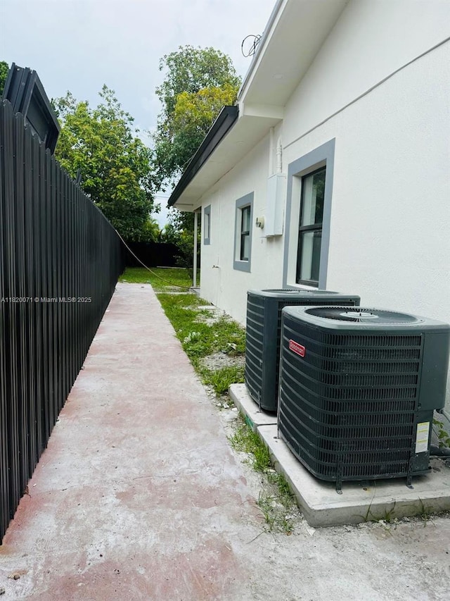 543 E 61st St, Hialeah, FL 33013 - view of home's exterior featuring stucco siding and a cooling unit