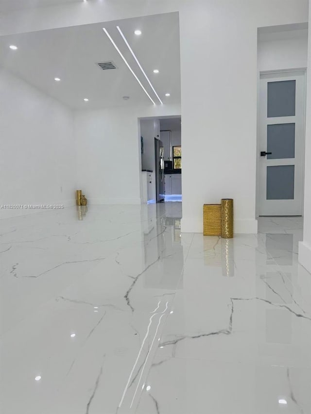 543 E 61st St, Hialeah, FL 33013 - unfurnished room featuring light marble finish flooring and recessed lighting