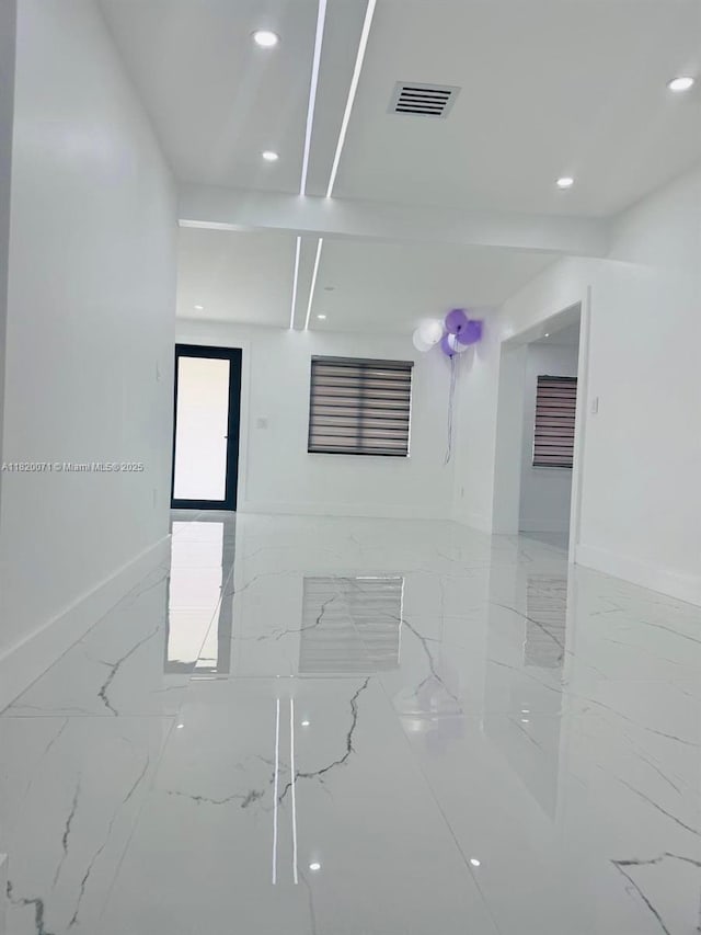 543 E 61st St, Hialeah, FL 33013 - unfurnished room featuring marble finish floors and recessed lighting