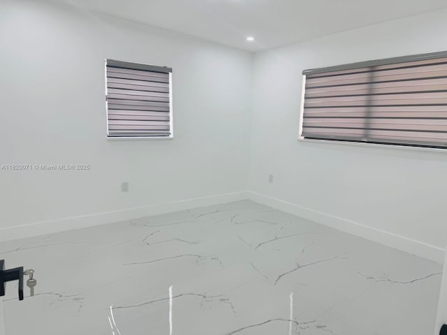 543 E 61st St, Hialeah, FL 33013 - unfurnished room featuring marble look tile flooring and recessed lighting