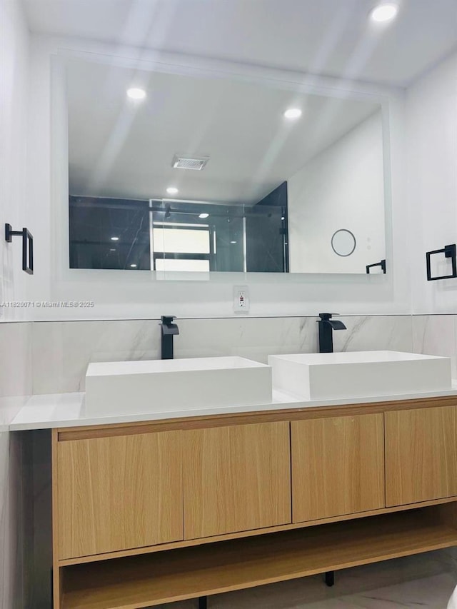 543 E 61st St, Hialeah, FL 33013 - full bathroom with double vanity, recessed lighting, and a shower