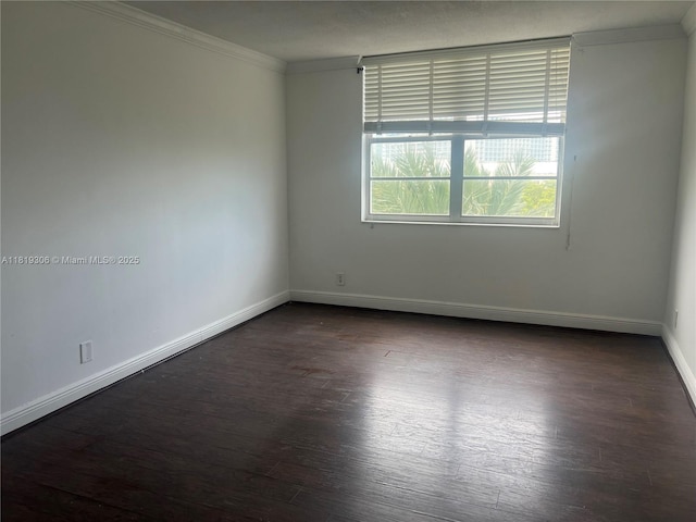 6770 Indian Creek Dr Unit 6D, Miami Beach, FL 33141 - unfurnished room with dark wood-style flooring and ornamental molding