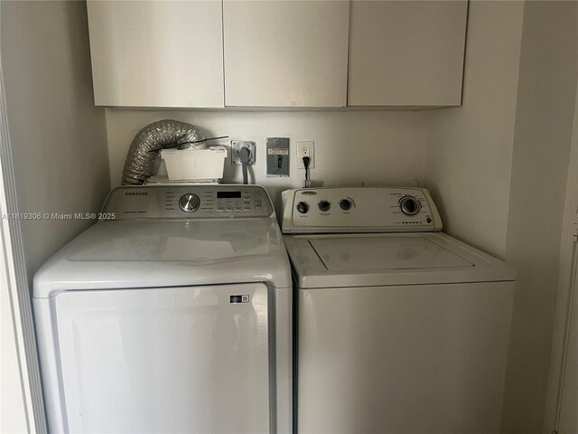 6770 Indian Creek Dr Unit 6D, Miami Beach, FL 33141 - laundry area with cabinet space and independent washer and dryer