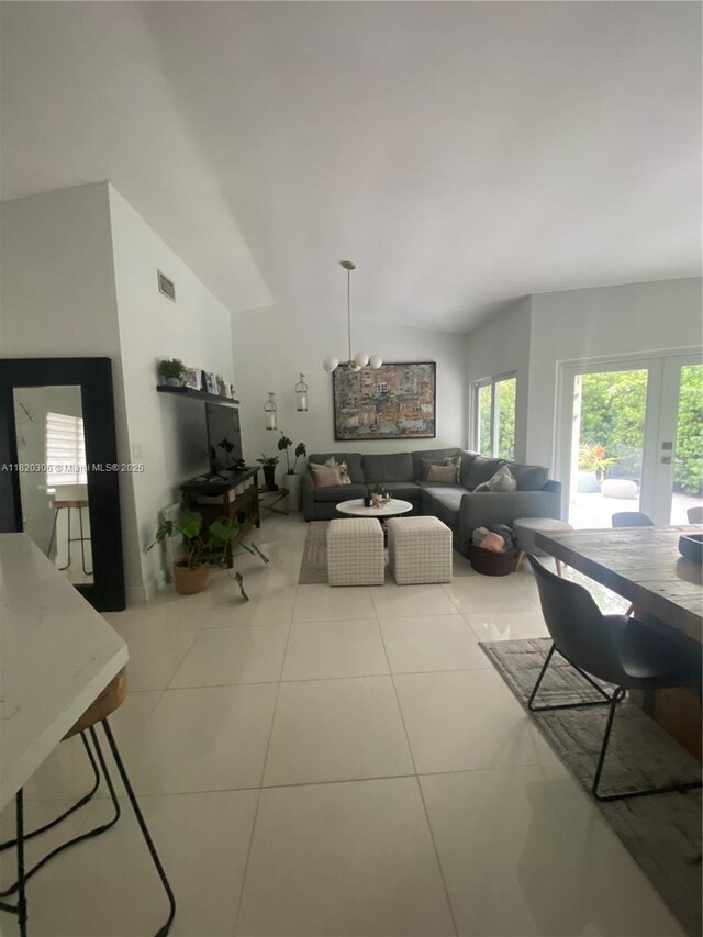 10090 NW 57th St, Doral, FL 33178 - living area featuring lofted ceiling and tile patterned floors