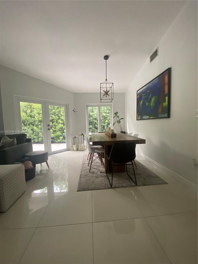 10090 NW 57th St, Doral, FL 33178 - dining room with tile patterned flooring and baseboards