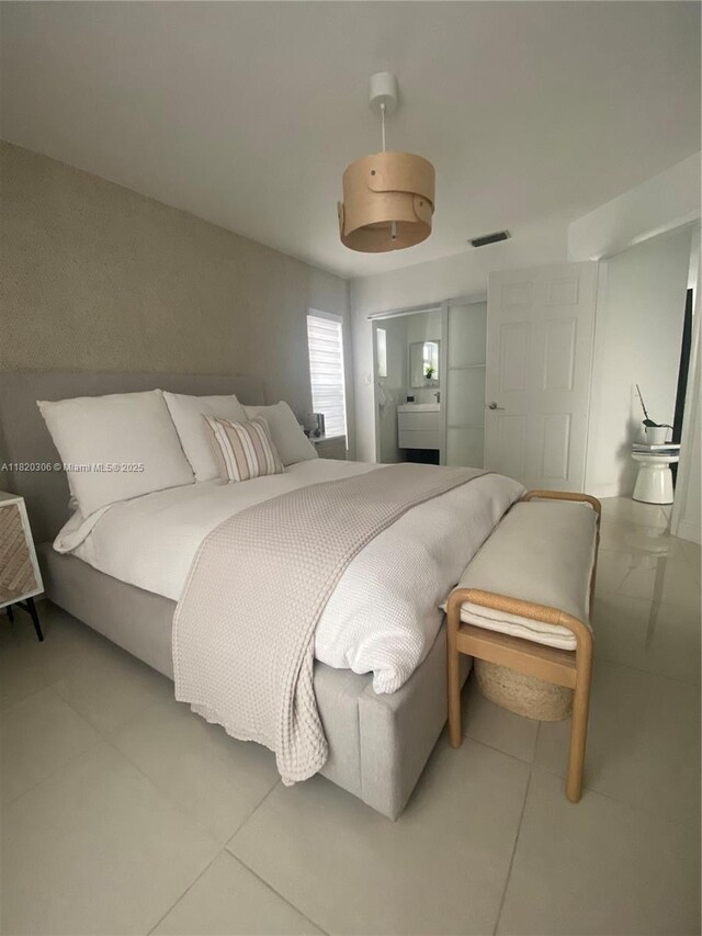 10090 NW 57th St, Doral, FL 33178 - bedroom with light tile patterned floors