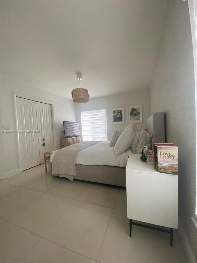 10090 NW 57th St, Doral, FL 33178 - tiled bedroom with a closet