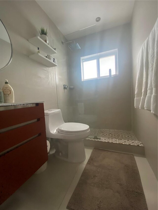 10090 NW 57th St, Doral, FL 33178 - bathroom featuring walk in shower, vanity, and tile patterned floors