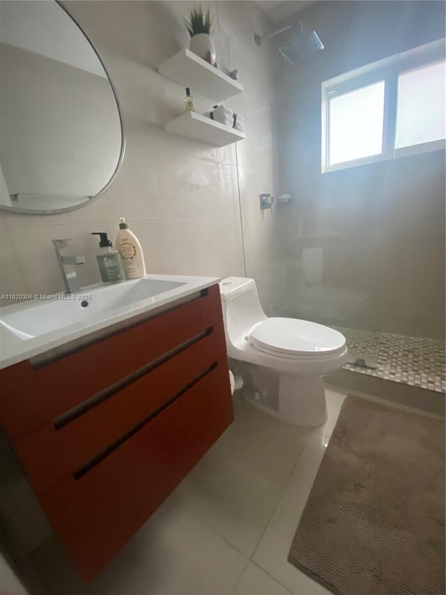 10090 NW 57th St, Doral, FL 33178 - full bathroom featuring tiled shower, tile patterned flooring, and vanity