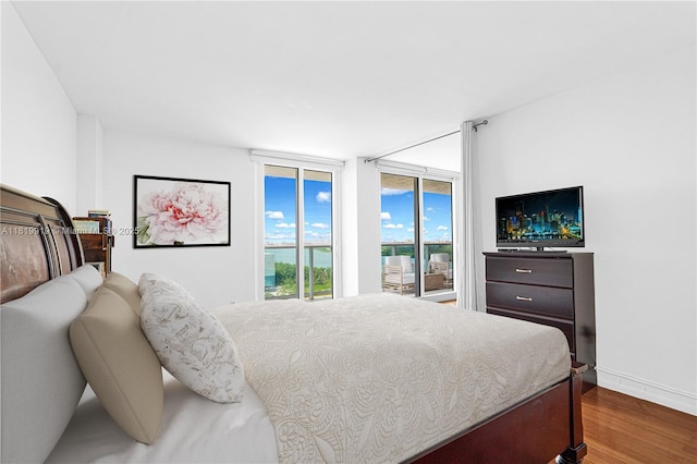 100 Bayview Dr Unit 1223, Sunny Isles Beach, FL 33160 - bedroom with wood finished floors and access to exterior