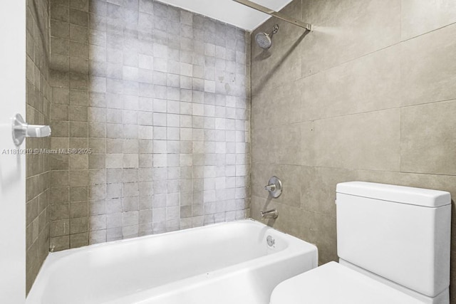 100 Bayview Dr Unit 1223, Sunny Isles Beach, FL 33160 - bathroom with tile walls and shower / bath combination