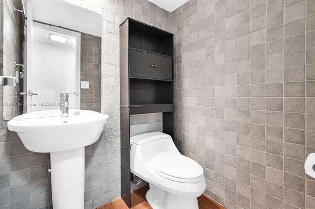 100 Bayview Dr Unit 1223, Sunny Isles Beach, FL 33160 - half bath featuring tile walls and wood finished floors