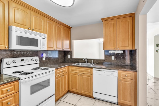 7801 Abbott Ave Unit 307, Miami Beach, FL 33141 - kitchen featuring white appliances, light tile patterned floors, and decorative backsplash