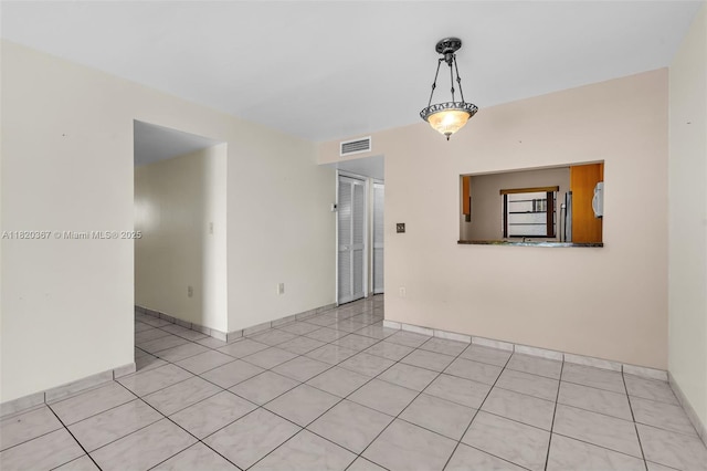 7801 Abbott Ave Unit 307, Miami Beach, FL 33141 - empty room featuring light tile patterned flooring