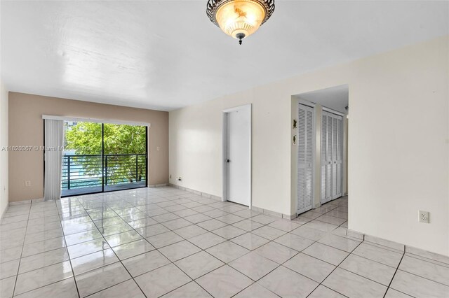 7801 Abbott Ave Unit 307, Miami Beach, FL 33141 - unfurnished room with light tile patterned flooring