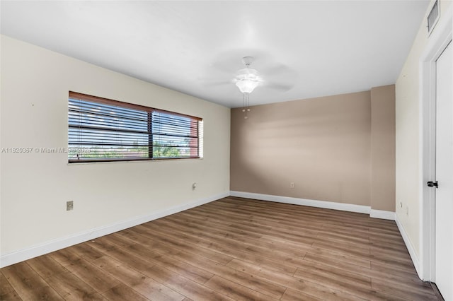 7801 Abbott Ave Unit 307, Miami Beach, FL 33141 - empty room with a ceiling fan and wood finished floors