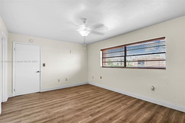 7801 Abbott Ave Unit 307, Miami Beach, FL 33141 - spare room featuring light wood-style floors and ceiling fan