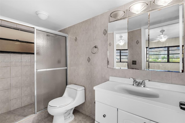7801 Abbott Ave Unit 307, Miami Beach, FL 33141 - full bathroom with tile walls, a shower stall, vanity, tile patterned floors, and ceiling fan