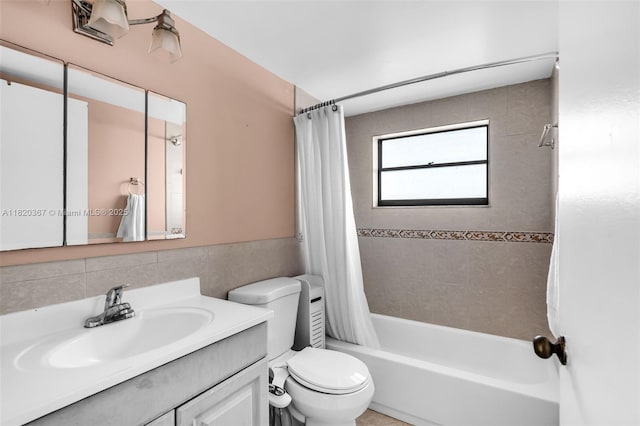 7801 Abbott Ave Unit 307, Miami Beach, FL 33141 - bathroom featuring shower / bath combo with shower curtain, vanity, and tile walls