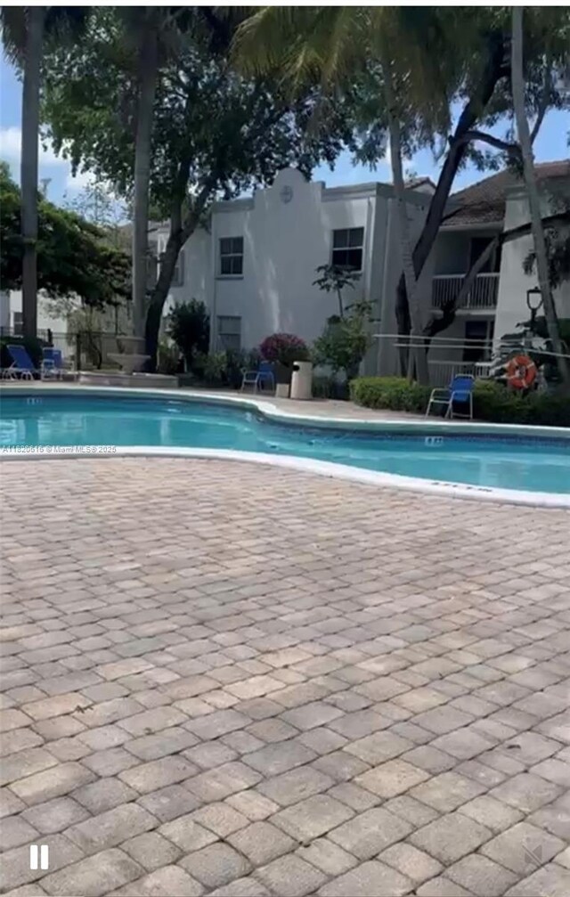 4659 NW 97th Ct Unit 35, Doral, FL 33178 - community pool with a patio