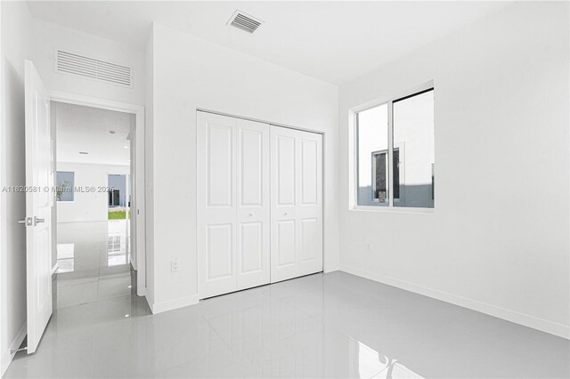 28841 SW 162nd Ave Unit A, Miami, FL 33033 - unfurnished bedroom featuring a closet and baseboards