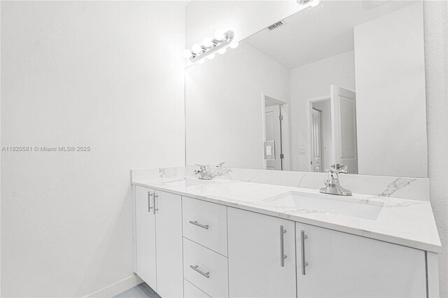 28841 SW 162nd Ave Unit A, Miami, FL 33033 - full bathroom with double vanity and baseboards