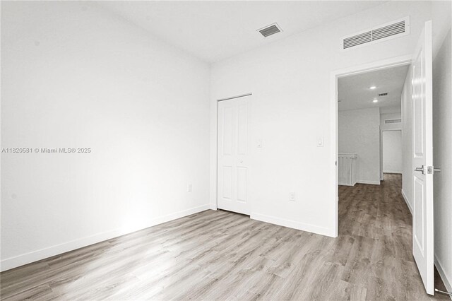 28841 SW 162nd Ave Unit A, Miami, FL 33033 - unfurnished bedroom with wood finished floors, recessed lighting, and a closet