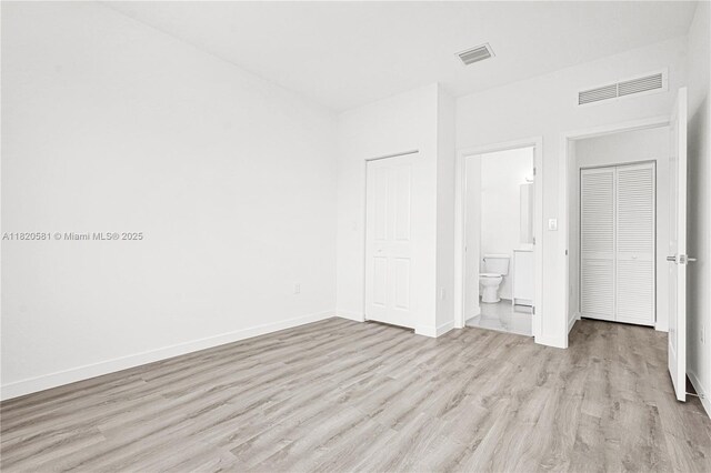 28841 SW 162nd Ave Unit A, Miami, FL 33033 - unfurnished bedroom featuring light wood-style floors and ensuite bathroom