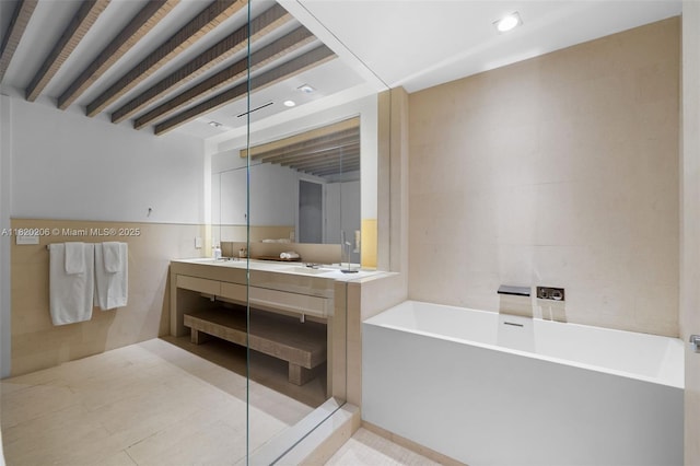 102 24th St Unit Ph-1706, Miami Beach, FL 33139 - full bath with double vanity, a soaking tub, tile walls, and recessed lighting