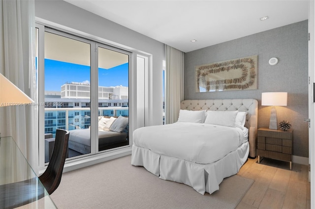 102 24th St Unit Ph-1706, Miami Beach, FL 33139 - bedroom with hardwood / wood-style flooring and recessed lighting
