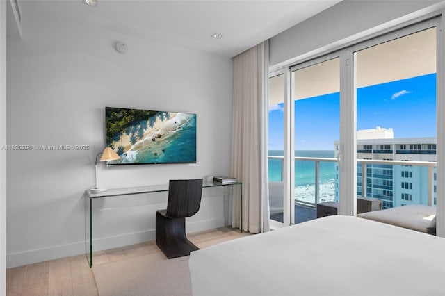 102 24th St Unit Ph-1706, Miami Beach, FL 33139 - bedroom with wood finished floors and built in study area