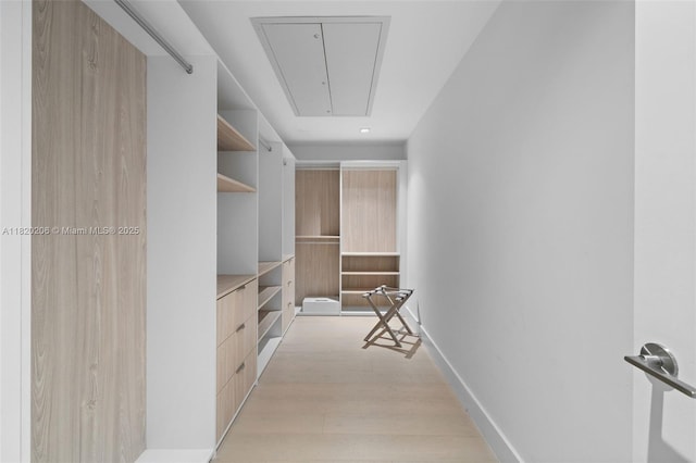 102 24th St Unit Ph-1706, Miami Beach, FL 33139 - spacious closet with attic access and light wood finished floors