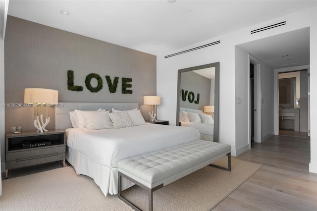 102 24th St Unit Ph-1706, Miami Beach, FL 33139 - bedroom featuring light wood-style floors and baseboards